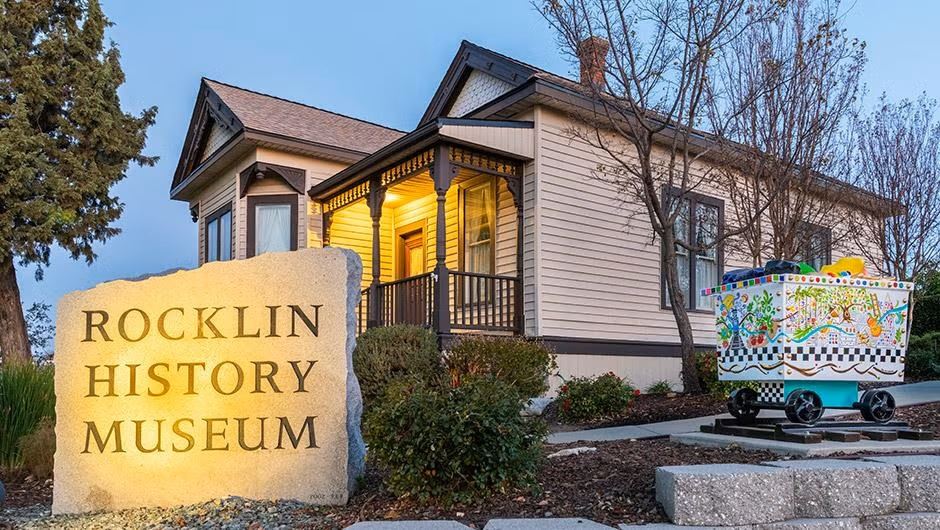 Rocklin History Museum sign and restored cottage in Rocklin, California